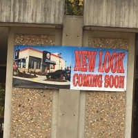 <p>A banner shows how the old bank building will be transformed into a Burger King.</p>