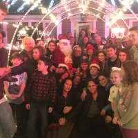 <p>Santa Boone, Bearn Vargas and Liz Twiggs, center, surrounded by some of the supporters at the party.</p>