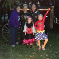 <p>The Ackerson Family poses in their haunted graveyard in Mahwah.</p>