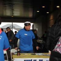 <p>Bergen County Vice Commander American Legion Post 57 Commander John Vervoot assists at a table during the TRACERS event.</p>
