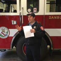 <p>James Gagliardo, Communications Coordinator for the Danbury Fire Department, praises a 9-year-old who called 911 to save his baby sister</p>