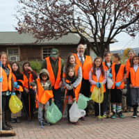 <p>Members of Jewish Youth Encounter assist park&#x27;s cleanup organizer Margot Moss with a volunteer project. </p>