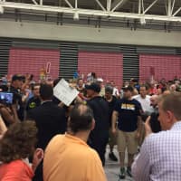 <p>A protester is removed from the gym at the William H. Pitt Center during the Donald Trump rally Saturday evening.</p>