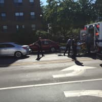 <p>The pedestrian hit by the car in Stamford Wednesday morning is loaded into an ambulance</p>