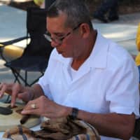 <p>Bob MacDonald of Dumont has been rolling cigars at the fair for a decade.</p>