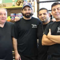 <p>Adel “Andy” Hanna, second from right, and company at Visentini Brothers Deli </p>