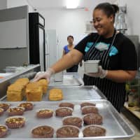 <p>Arianne Polanco, of New York, is one of Isaura Bakery&#x27;s bakers. </p>
