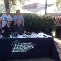 <p>The Danbury Titans hockey is excited for the new season. Back row, Tommy Pecoraro, broadcast staff, and Katie Lockwood, Booster Club member; Front row, General manager Tricia Coe and Booster Club President Ed Lockwood.</p>