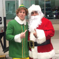 <p>Closter Police Officer Louie Ruiz as Santa and Buddy the Elf.</p>
