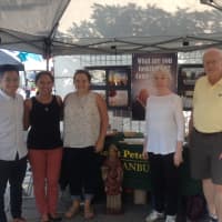 <p>From left, Long Nguyen, Anne Closa and Alex Cernick, all of Fellowship Of Catholic University Students, and Christine Moore and John Feeney, of St. Peter Parish in Danbury, stand ready to share their faith.</p>
