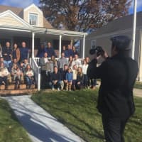 <p>Tim Hillmann snaps the Belthoff family photo in New Milford Sunday morning.</p>