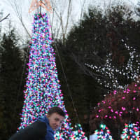 <p>Daniel Eisenberg of Demarest arranges a Christmas display on his front lawn in memory of his late mother. </p>