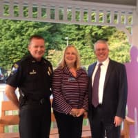 <p>Easton Police Chief Tim Shaw, Debra A. Greenwood, president and CEO of the Center for Family Justice, and Easton First Selectman Adam Dunsby attend the Center for Family Justice&#x27;s vigil Monday at the Easton Community Center.</p>