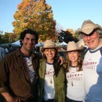 <p>Karyn Leito (second from left) and Michelle Margo, organizers of the Black Rock Farmers Market, enjoy a sunny day with their husbands John Leito (left) and Robert Lendrim.</p>