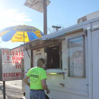 <p>A regular customer waits for his hotdog order in Bergenfield at Mark&#x27;s Hot Dogs. </p>