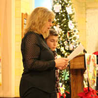 <p>Stephen Petruzzello&#x27;s mother, Linda, does one of the readings during Mass.</p>