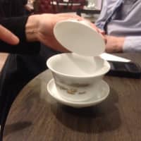 <p>Shu-Chuan Chen points out the components of a traditional Taiwanese tea cup, gaiwan, which refers to the lid used to keep tea leaves out of the drinker&#x27;s mouth when sipping tea. The gaiwan can be used for both brewing and drinking tea.</p>