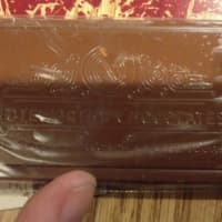 <p>A small example of what Noteworthy Chocolates in Bethel produces is this chocolate business card. A real, unmeltable card is attached to the back of the wrapper.</p>