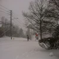 <p>Only one person, a man with a shovel, is walking on Prospect Street, near Grove Street mid-morning.</p>