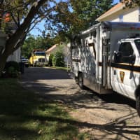 <p>Police investigators at 51 Plattsville Ave., Norwalk. A man reportedly was working on a pickup truck when it fell on him Friday.</p>