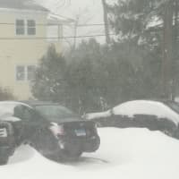 <p>By noon some cars need digging out in a Prospect Street lot in Ridgefield.</p>