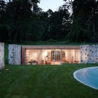 <p>The house sits on over 6 acres of land and features four bedrooms and a swimming pool.</p>