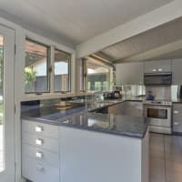 <p>The newly renovated kitchen features beautiful granite countertops.</p>