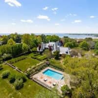 <p>The estate includes 6.5 acres of land, views of the sound, and a swimming pool.</p>