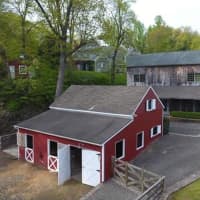 <p>The refurbished red barn is part of the home&#x27;s rural appeal.</p>