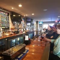 <p>Patrons at Icons Sports Bar &amp; Grill in New Fairfield, Conn., can watch the game on any of its nine TV sets, three of which are located behind the bar.</p>