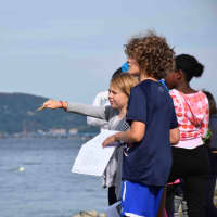 <p>Main Street School students threw oranges into the Hudson River to test water current as part of the Irvington Union Free School District’s Hudson River Study at Matthiessen Park.</p>