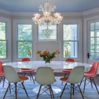 <p>The newly renovated interior includes a dining room overlooking the five-acre property.</p>