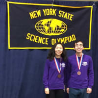 <p>John Jay High School students Nicholas Aoki and DeeAnn Guo, pictured, served as team captains at a recent science olympiad.</p>