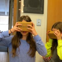 <p>From left, John Jay Middle School students Aidan Summer and Julia D’urso use Google Cardboard devices for a virtual-reality tour of Egypt.</p>