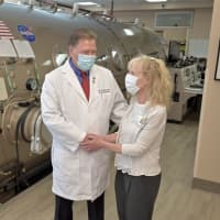 <p>Eileen Egan (right), executive director for Phelps Hospital congratulates Dr. Owen J. O’Neill, medical director Division of Undersea and Hyperbaric Medicine at Phelps Hospital for receiving the 2022 Excellence in Hyperbaric Medicine Award from UHMS.</p>