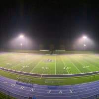 <p>The football field is lit up Friday, May 8 at John Jay High School.</p>