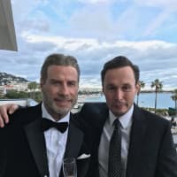 <p>Westchester native Chris Kerson, right, with John Travolta iat Cannes 2018, where &quot;Gotti&quot; was first screened in May. Kerson was able to see the film as it was edited with credits, music and titles for the first time, a thrill for a working actor.</p>