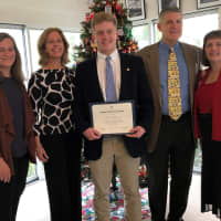 <p>John Lochtefeld receives the award from Darien&#x27;s Good Wife&#x27;s River Chapter DAR Good Citizen Chairperson Kim Kiner as his parents, Nancy and father Tom, and DAR Good Good Wife&#x27;s River Chapter Regent, Katherine Love look on.</p>