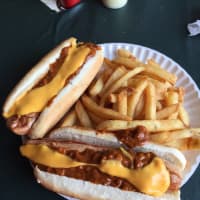 <p>Jolly Nick&#x27;s doesn&#x27;t skimp on the cheese and chili for its deep-fried dogs.</p>