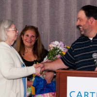 <p>Judy Jensen is congratulated for 50 years of service at Cartus by Dan Fisher, director of operations accounting, and Anat Schneider, manager of Client Finance, Corp F&amp;A, on her big day.</p>