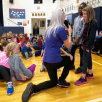 <p>Katonah Elementary School students Aminata Gueye, pictured at left, and Claire Schwark, pictured at right, share ideas about how to be champions with Kathryn Whisler of &quot;The NED Show.&quot;</p>