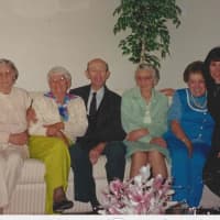 <p>Karen Ganis and her father with her sisters</p>