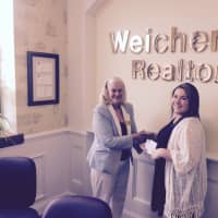 <p>Sara J. Brine, manager of Weichert Realtor&#x27;s Closter office, presents the award to Kelsey Stewart.</p>
