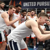 <p>Former Westchester high school basketball standout Ty Jerome, shown standing in the center behind teammate Kyle Guy (front), and the Virginia Cavaliers will take their shot at the NCAA Tournament on Monday night.</p>