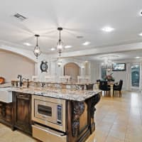 <p>The gourmet kitchen features a large granite island, high-end appliances and a wine cellar via a butler&#x27;s pantry, Pais said.</p>
