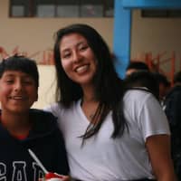<p>Former Greenwich High School student Laura Rivera-Martinez is shown with a boy she met in Ecuador as a Global Glimpse Ambassador in 2018.</p>