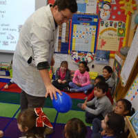 <p>The students identified different scents in a balloon and cans during the experiments.</p>
