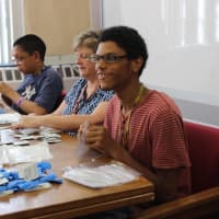 <p>Ossining High School Life Skills students are shown at work in a summer program.</p>