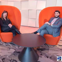 <p>Lynne Zappia and Julian Diaz, of BHG Rand Realty,  are dwarfed by &quot;The Jetsons&quot;-like, but cozy, chairs in the lobby of The Light House, a new luxury apartment building in Port Chester.</p>