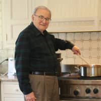 <p>Cookbook Author Anthony LoFrisco stirs up some of his favorites at his Wilton home.</p>